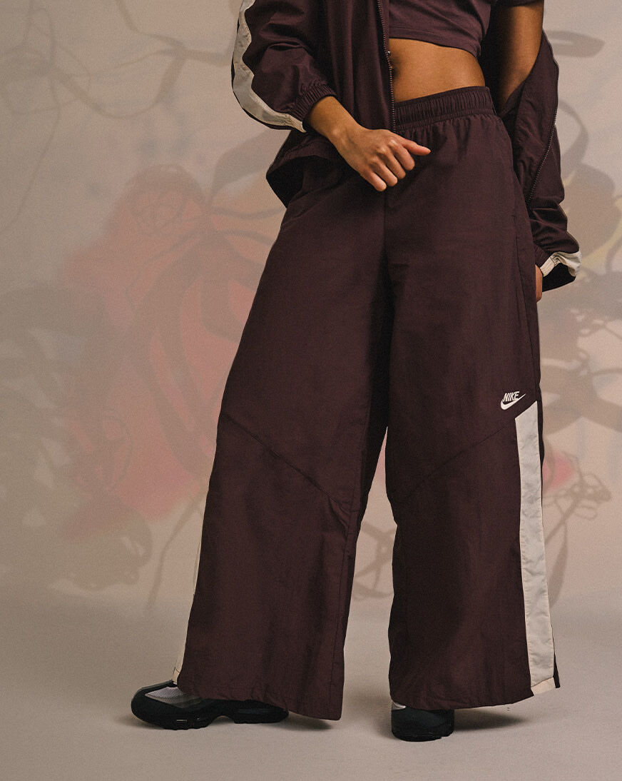 Shop Nike NSW Wide-Leg Woven Pants IH8508-502 purple | SNIPES USA