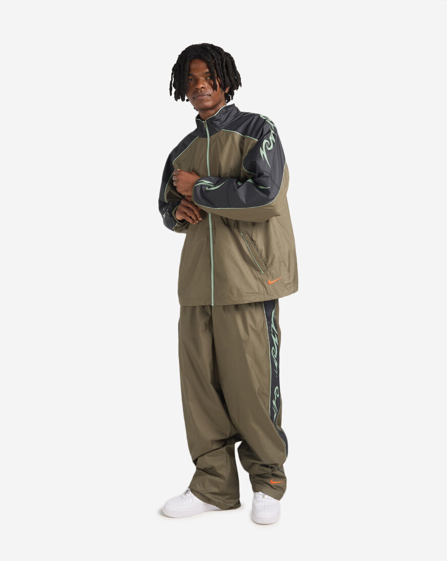 Shop Nike Graphic Track Pants IO1736-222 green | SNIPES USA