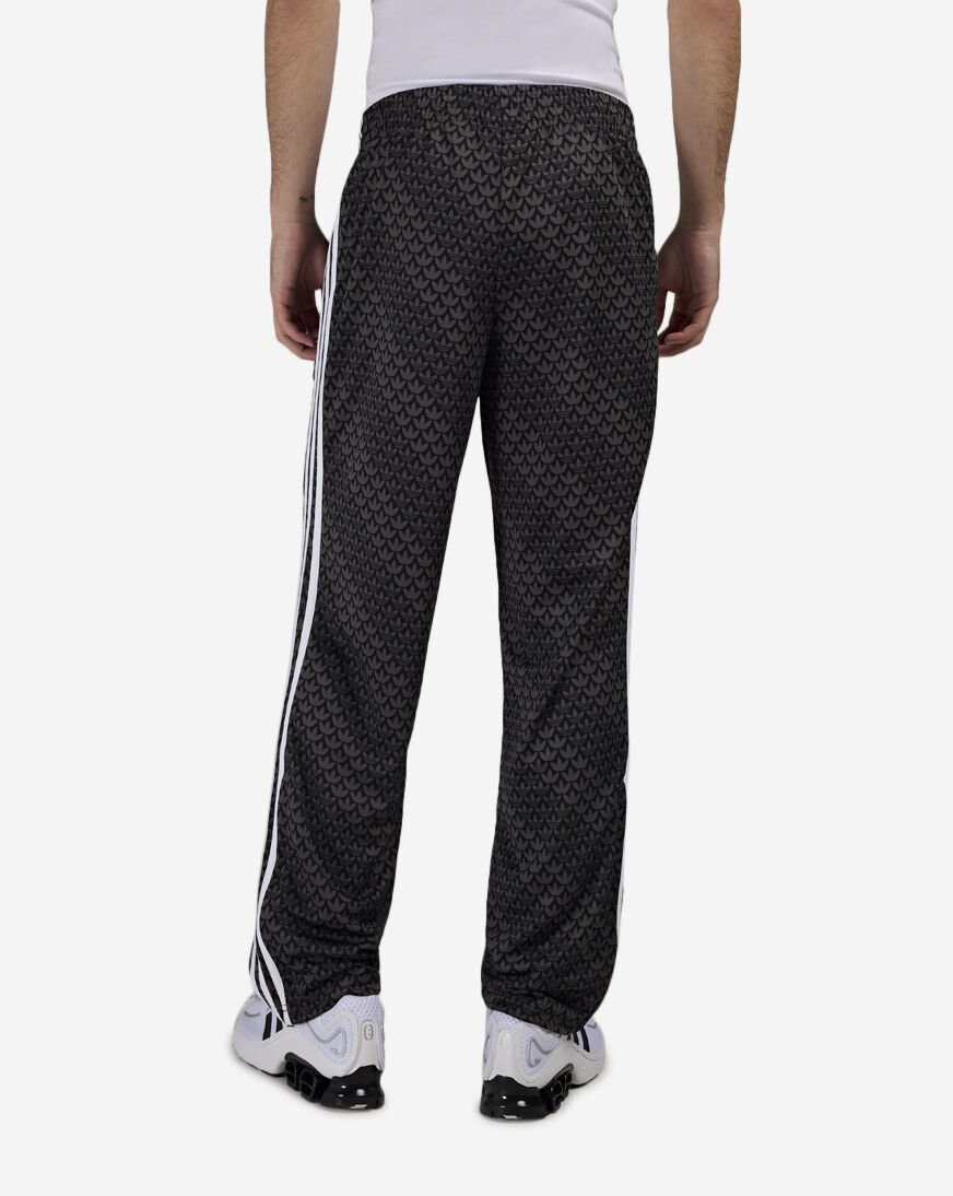Shop adidas Firebird Loose Monogram Track Pants KC9159 black
