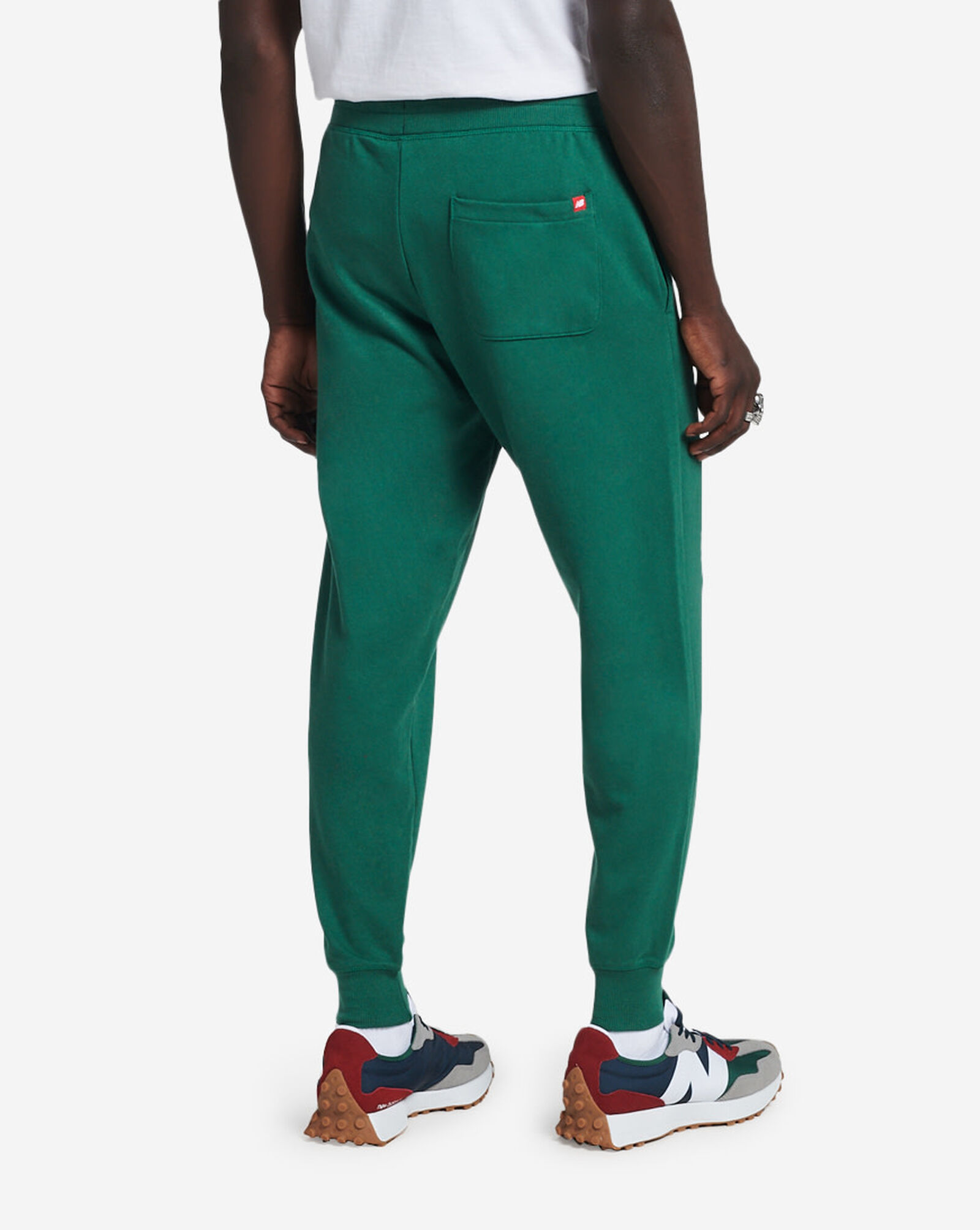 Shop New Balance Essential Stacked Logo Sweatpants MP03558TFN green
