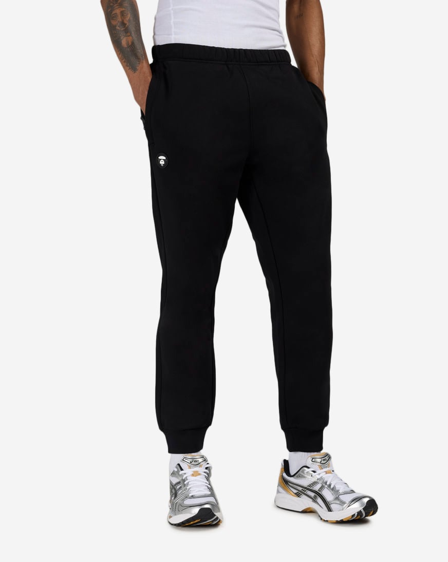 Shop AAPE Now Fleece Sweatpants AAPPTMC636XXP-BKX black | SNIPES USA