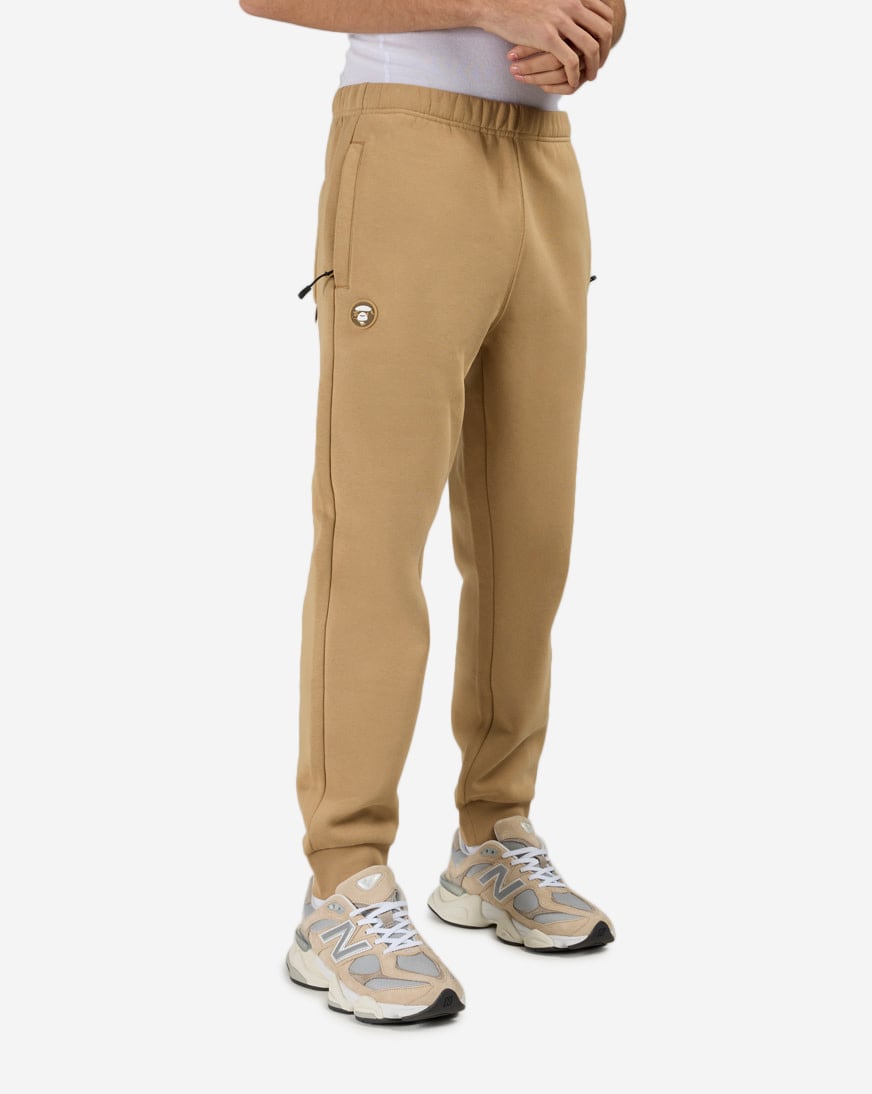 Shop AAPE Now Fleece Sweatpants AAPPTMC636XXP-BGX beige | SNIPES USA