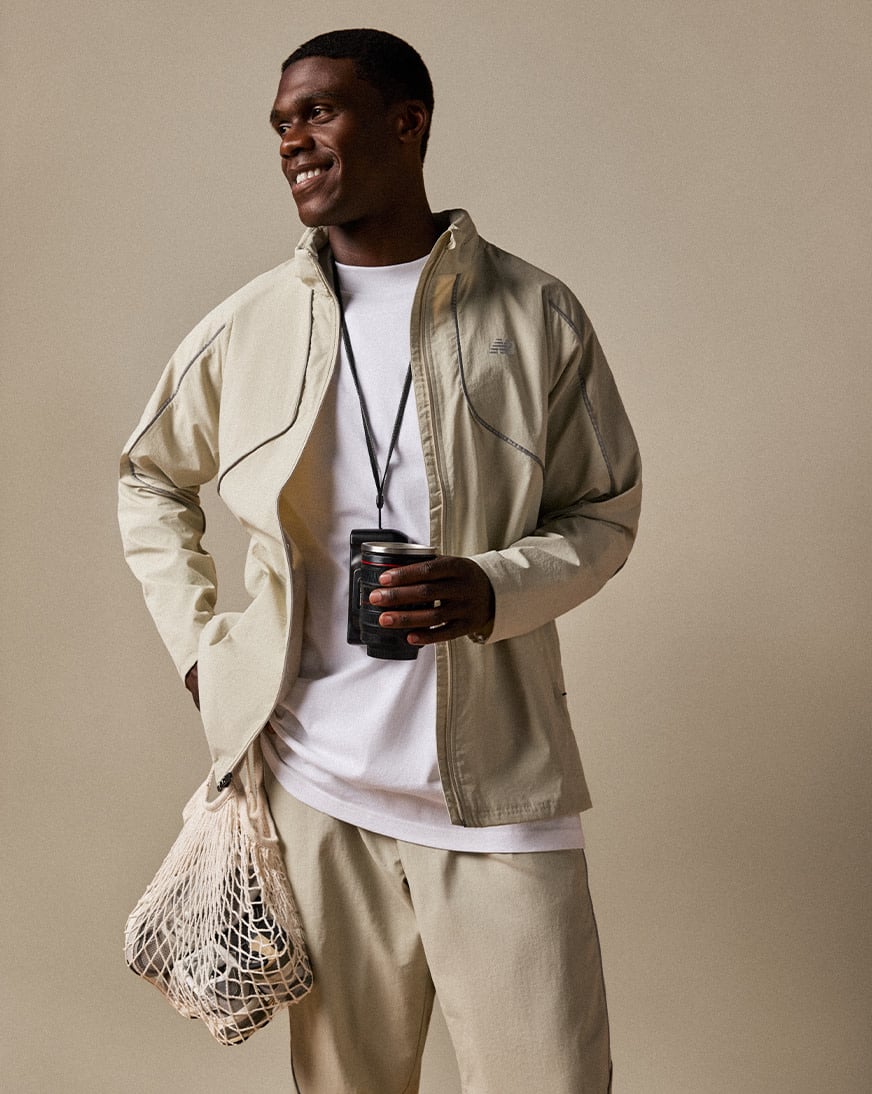 Shop New Balance Reflective Woven Jacket MJ61E2BY-SHY beige