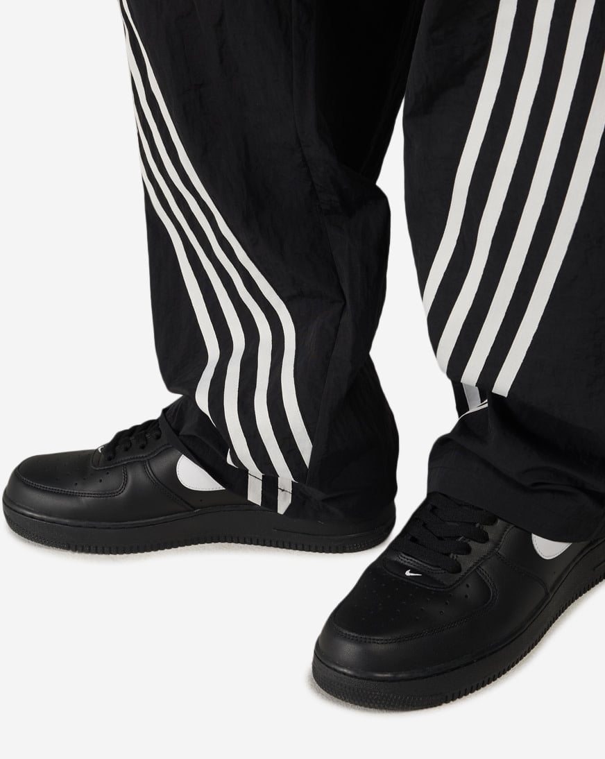 Shop Decibel Vertical Stripe Nylon Pants FW26B6201-BLK black