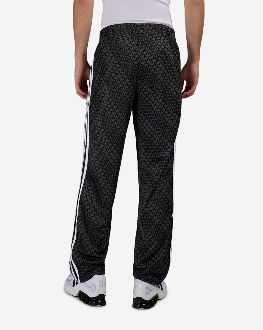 Shop adidas Firebird Loose Monogram Track Pants KC9159 black