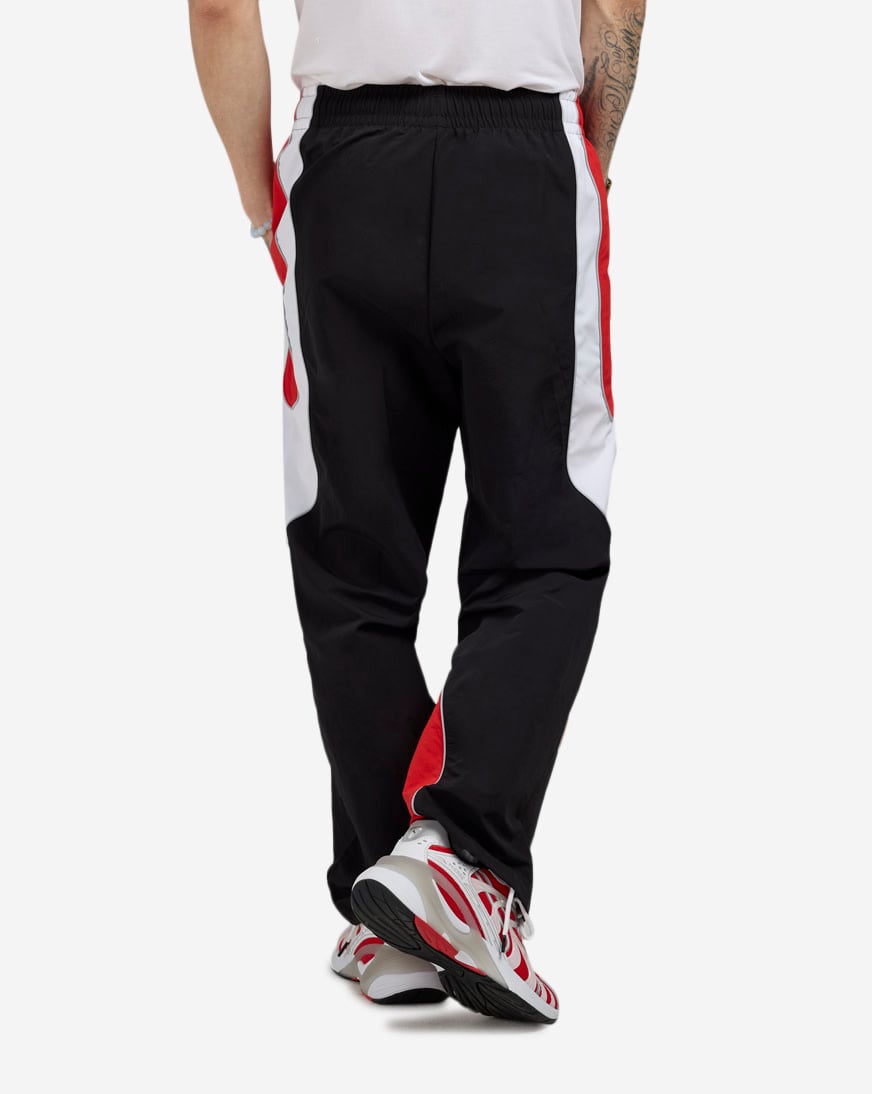 Shop Puma PUMATECH-X Colorblock Relaxed Track Pant 63434701 black