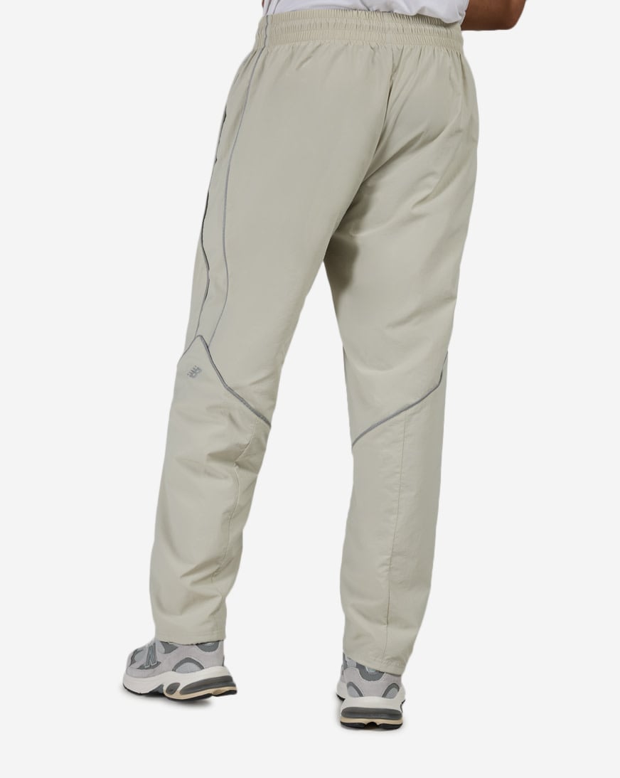 Shop New Balance Reflective Woven Pants MB61Q27Z-SHY beige