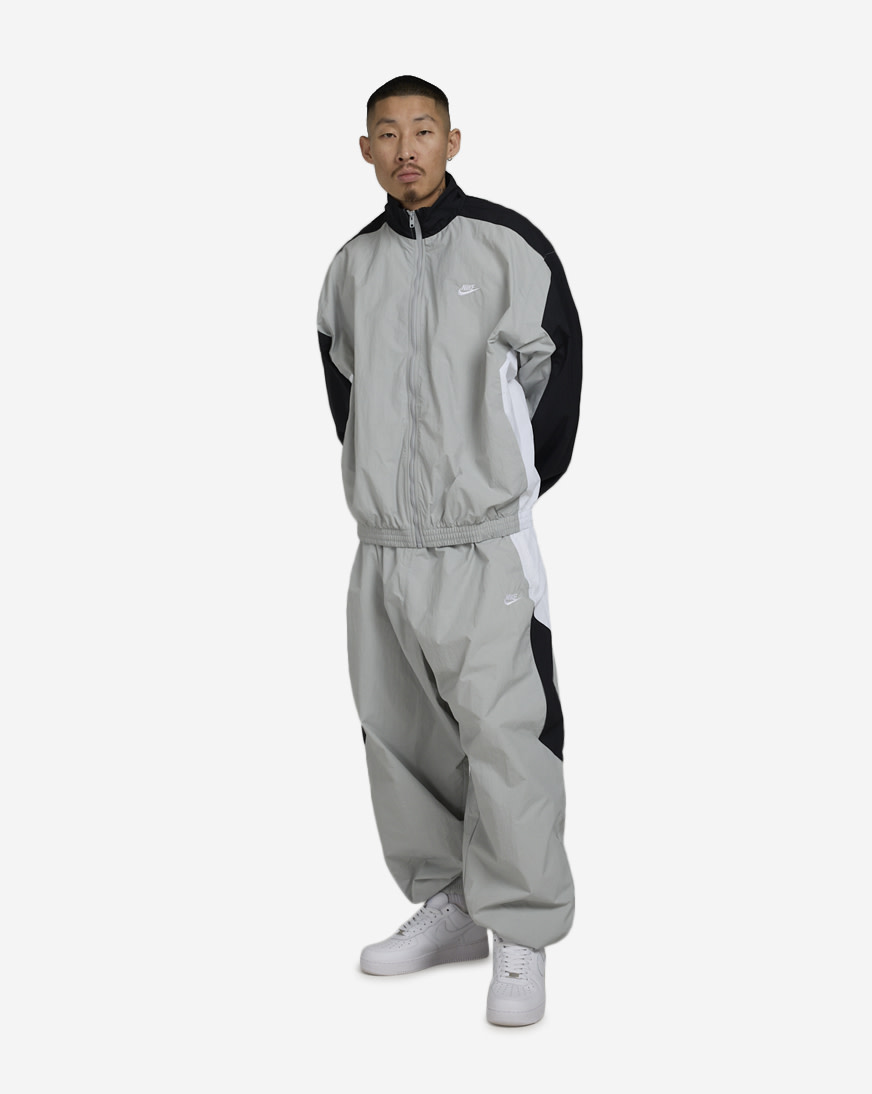 Shop Nike Club Woven Track Jacket HQ6109-077 grey | SNIPES USA